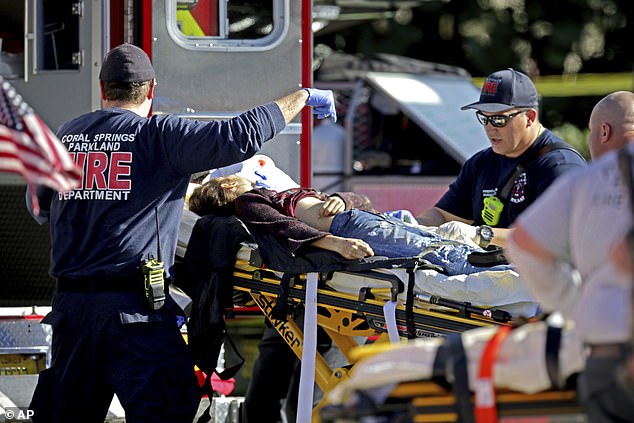 Medical staff treat victim after shooting at Marjory Stoneman Douglas High School