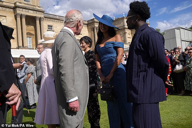 The Love Island presenter, 29, greeted the King and Queen Camilla while attending Sovereign's Creative Industries garden party at Buckingham Palace on Wednesday.