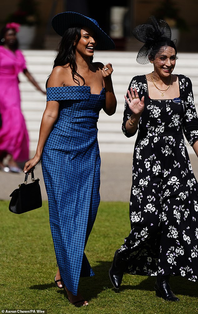 The Love Island presenter, 29, turned heads in the long off-the-shoulder dress which featured a daring slit in the back.