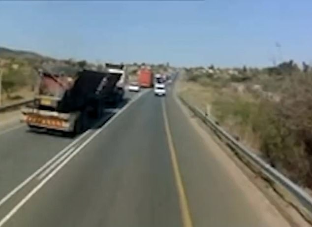 Shocking dash cam video shows the heavy vehicle hurtling down the wrong side of the road, overcoming traffic.
