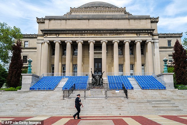 Pictured: A New York City police officer patrols inside Columbia University, the prestigious university at the heart of the US campus of anti-war protests in Gaza.