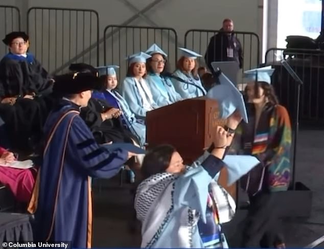 He quickly tore up his diploma after receiving it.