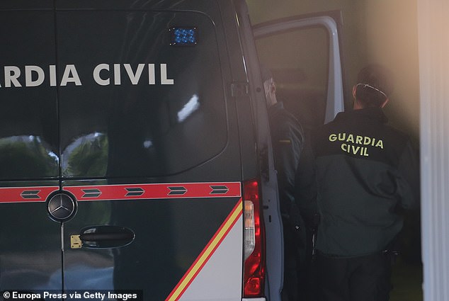 Authorities in Madrid, Spain, were seen removing Román from a police van on May 12, 2021.