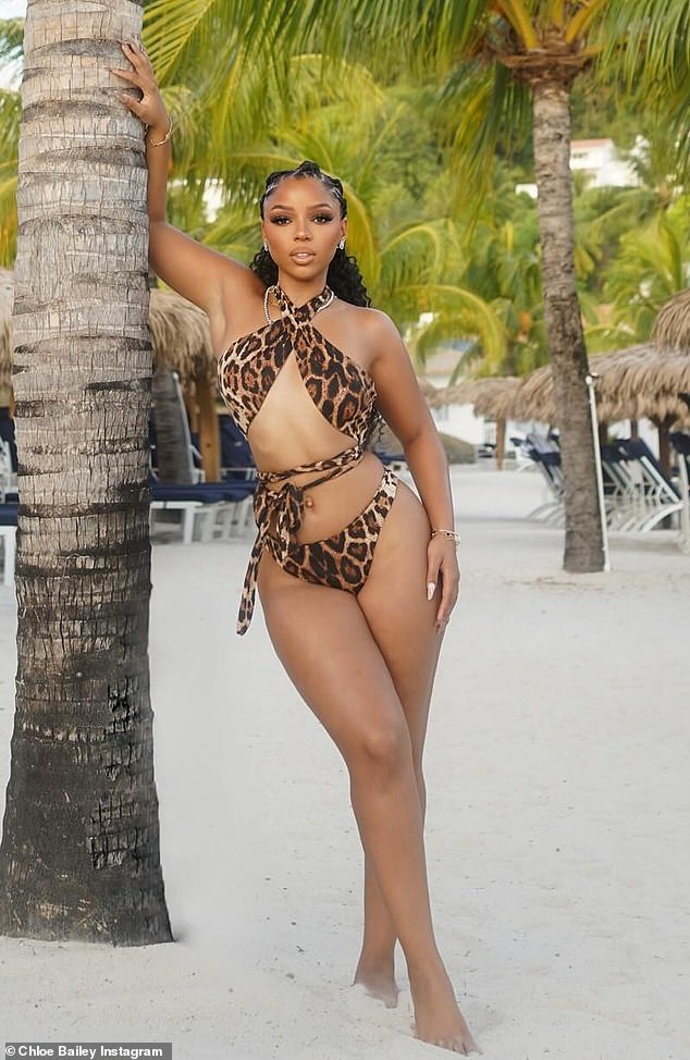 The 25-year-old singer ¿who is currently in Saint Lucia¿ modeled a leopard-print swimsuit with a criss-cross halter neck design.