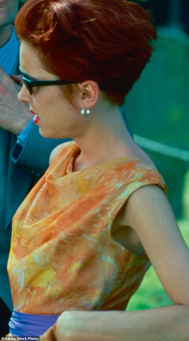 Coleman's character, Scarlett, sports a particularly striking orange version in the film's iconic opening scene.