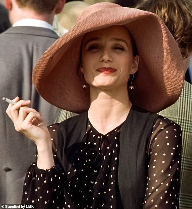 Fi, played by Scott Thomas, has as her signature accessory a wide-brimmed raffia hat that she wears at several of the film's weddings.