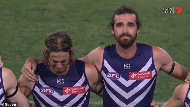 Fremantle players including Nat Fyfe (left) and Alex Pearce (right) fought back tears as they paid tribute to their teammate the day after his death.