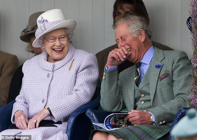 Queen Elizabeth II and her son, Charles, laugh as they watch the children's sack race at the Braemar Highland Gathering 2012.