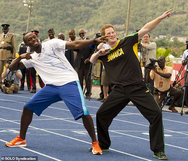 Prince Harry emulates Usain Bolt's signature gesture after a 100-meter race against the world record holder in Jamaica in 2012.