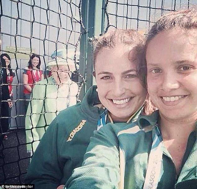 Queen Elizabeth photographs a selfie taken by two players from the Australian women's hockey team on the first day of the Commonwealth Games in Scotland, 2014.