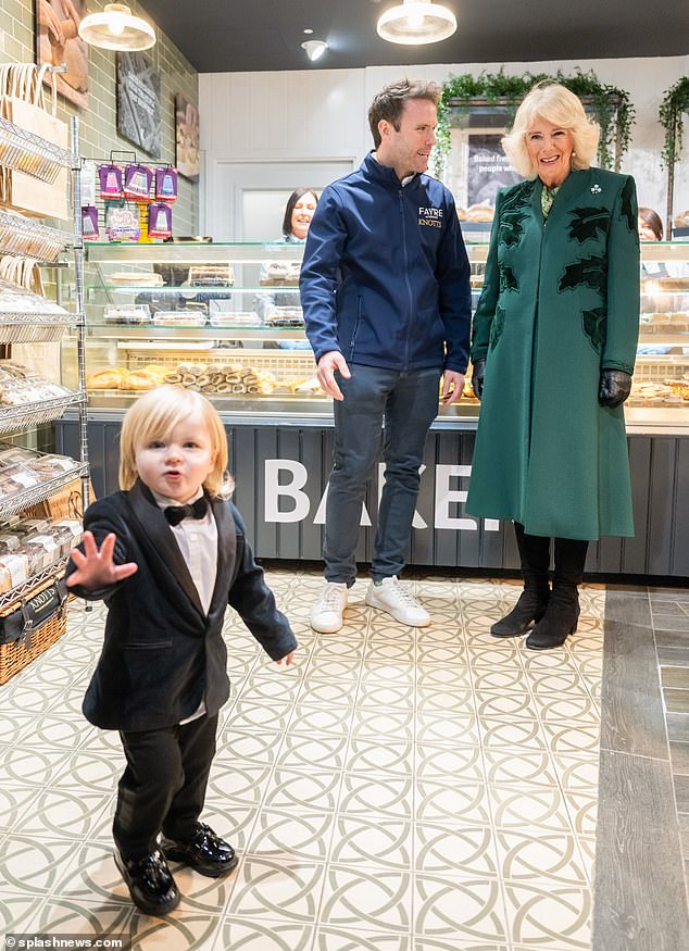 Fitzwilliam Corrie-Salmon, 23 months, steals the show from Queen Camilla during a visit to a bakery in Northern Ireland in March this year.