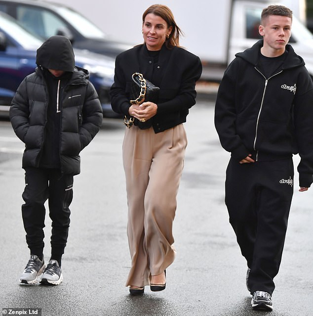 Coleen smiled as Klay tilted his head, almost disappearing into his hoodie, and Kai fidgeted with his tracksuit.