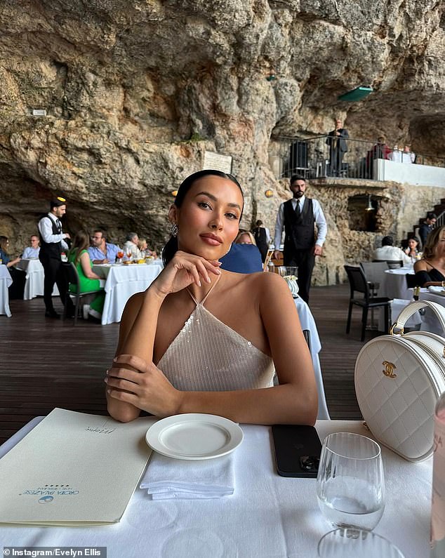 The brunette beauty turned heads in a sheer, ankle-length dress, leaving little to the imagination as she dined at a cave restaurant in the heart of Puglia, Italy.