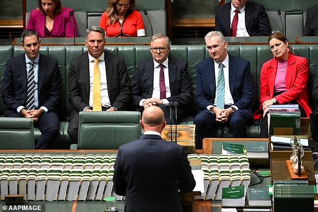 Prime Minister Anthony Albanese watches as Peter Dutton delivers his budget response