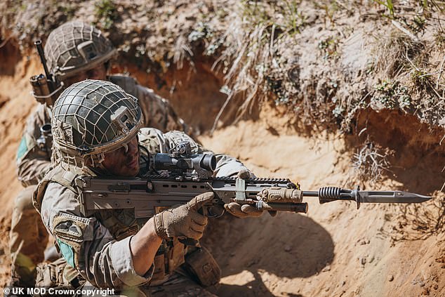 Leading Soldier from Company B, 3rd Battalion, Parachute Regiment, looks around the corner of the trench during the Combined Arms Live Fire Exercise (CALFEX) phase of Exercise Rapid Response on May 4, 2024 .