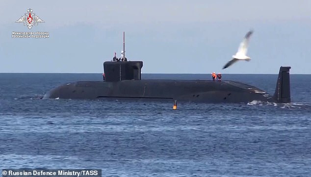 A video screenshot shows the Borei K-535 Yuri Dolgoruky-class nuclear-powered submarine after launching an RSM-56 Bulava ballistic missile into the Barents Sea.