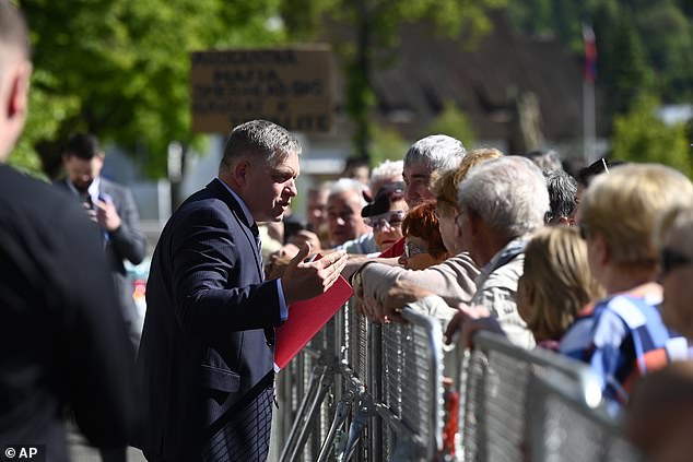 Robert Fico pictured talking to people before the cabinet session outside House in the town of Handlova, Slovakia.