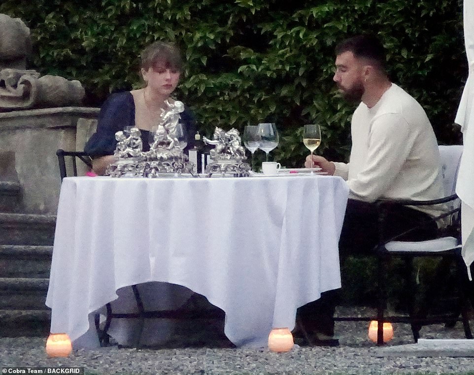 The couple drank wine while relaxing under the stars.