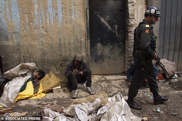 He compared the chaos to the scenes on Cartucho Street in Bogotá, previously one of the most dangerous neighborhoods in the city. In the photo: A Colombian army soldier patrols Cartucho Street in Bogotá on Saturday, May 30, 1998.