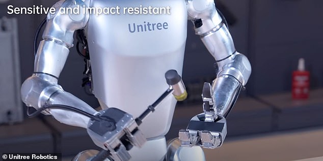 In a creepy clip, the child-sized robot can be seen breaking its hand with a sledgehammer.