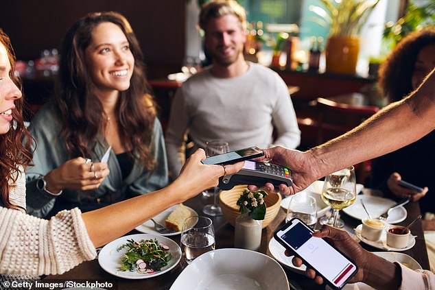 App creators have invented simple new ways to split bills fairly and avoid the awkward conversation that arises at the end of group dinners or trips with friends (stock image)