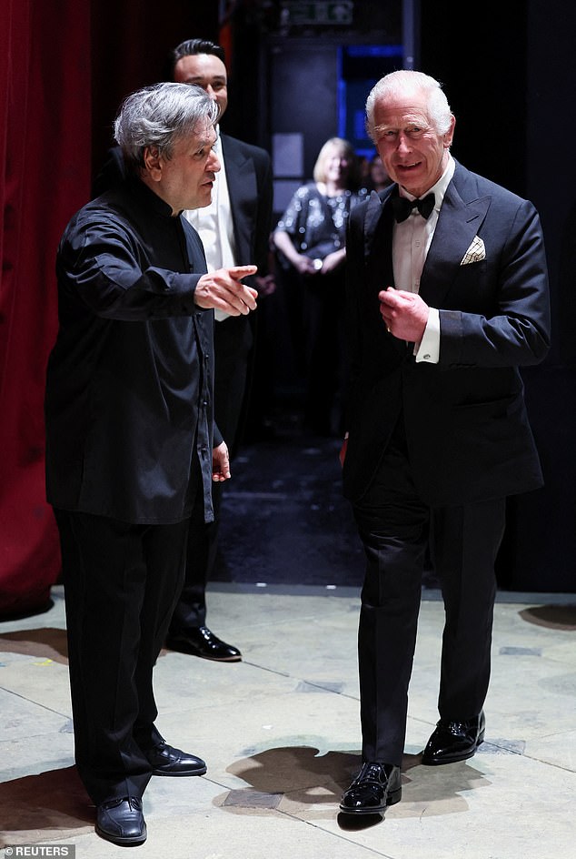 King Charles walks alongside Antonio Pappano this afternoon at the Royal Opera House in London