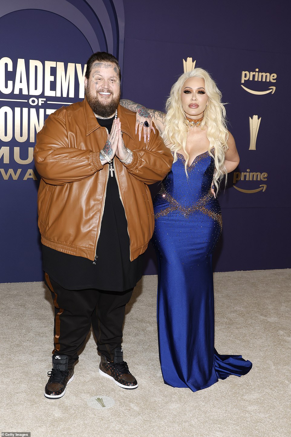 Bunnie, whose real name is Alyssa DeFord, flaunted her killer curves in a royal blue satin dress with sparkly embellishments at the bust and waist.