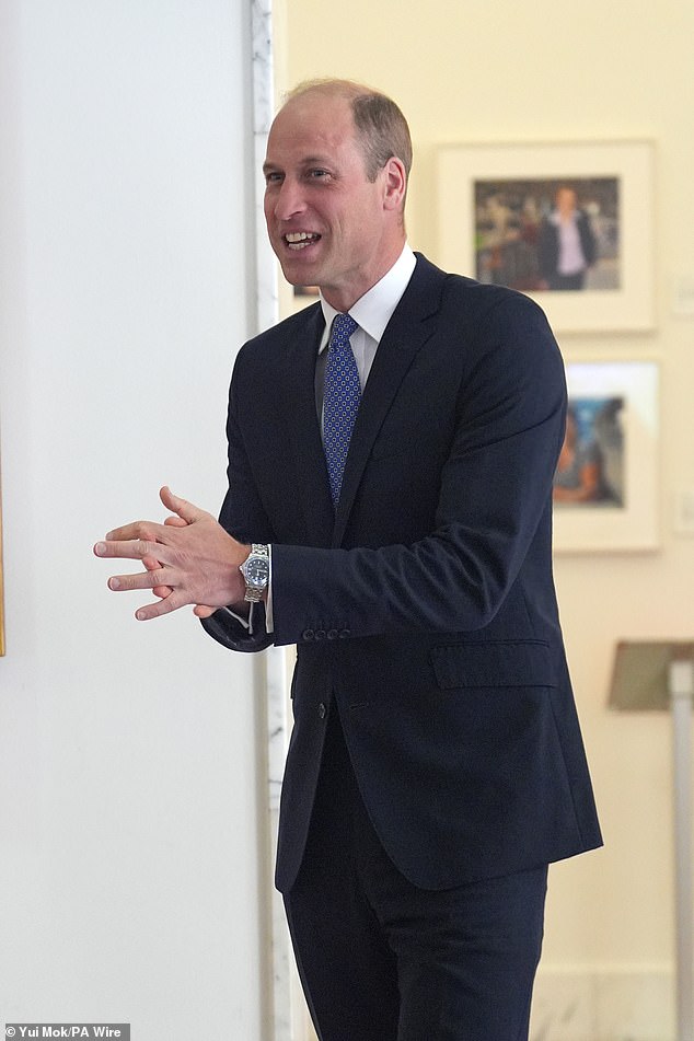 The father of three smiled as he rubbed his hands while chatting with attendees at the event.