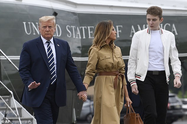 Melania Trump, as first lady, largely kept Barron out of the spotlight; above, then-President Donald Trump with his wife and son in August 2020