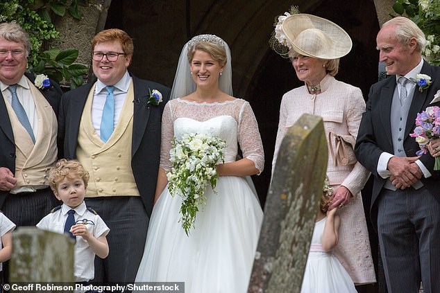 Sarah's daughter Emily married George Woodhouse in Lincolnshire, with Prince Harry and Meghan Markle among the wedding guests. Above: The special day of 2018