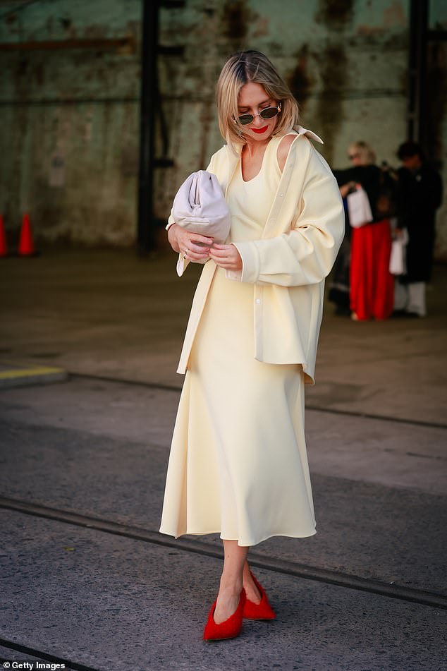 The former WAG blogger turned mummy, 33, showed off her unique style in an unbuttoned lemon blouse paired with a matching dress.