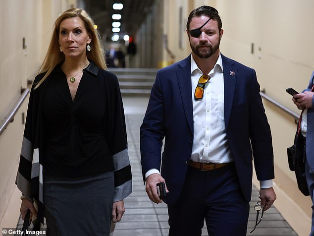 Beth Van Duyne is seen walking with Rep. Dan Crenshaw in the basement of the Capitol.