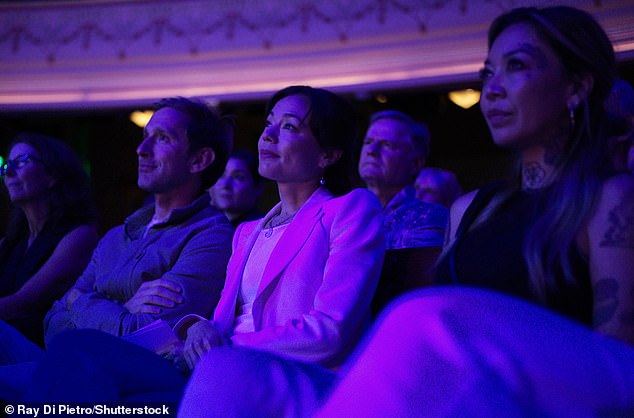 RFK Jr's running mate Nicole Shanahan enjoys Rob Schneider's set at the same show.