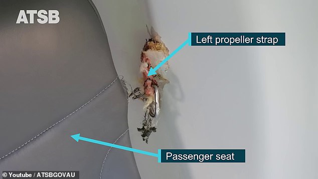 The propeller belt separated from the rotating propeller blade and became embedded in the cockpit wall.