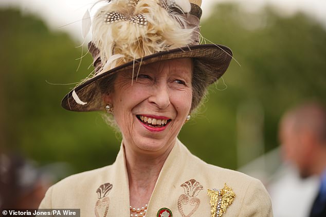 Princess Anne looked stunning today as she wore an elegant beige ensemble with two gold brooches.