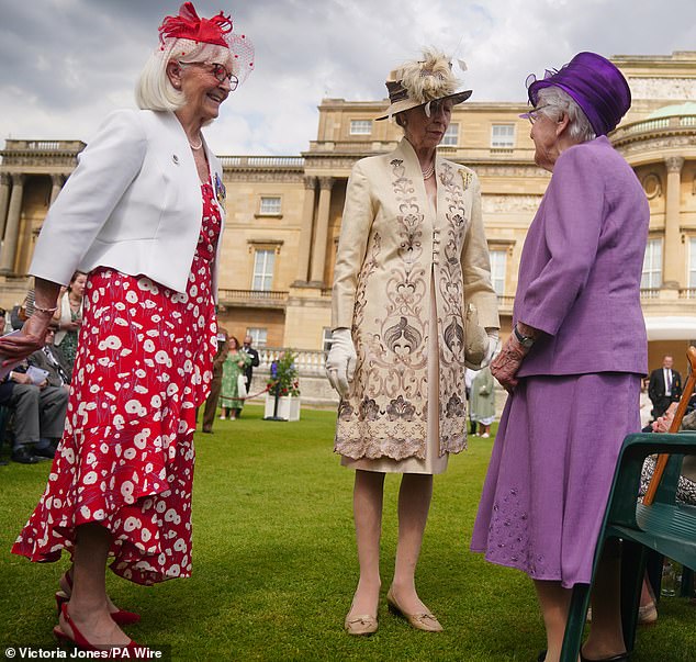 Visitors dusted off their best suits and most elegant dresses while chatting with the Princess Royal, who toured the colorful garden.