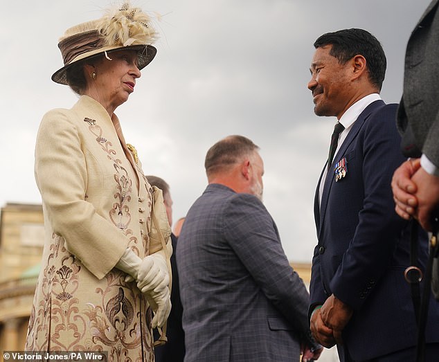 Anne opted to wear a matching jewelery set to tie her look together as she chatted with guests.