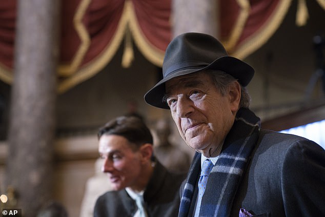 Paul Pelosi attends an unveiling ceremony for his wife's portrait in Statuary Hall on Capitol Hill in Washington on December 14, 2022. He was frequently seen wearing a hat following the attack.