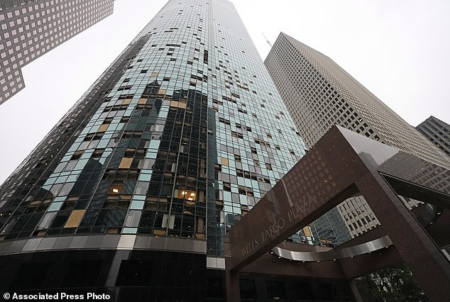 Broken windows on a high-rise building in the city center are shown after a severe storm on Friday, May 17.