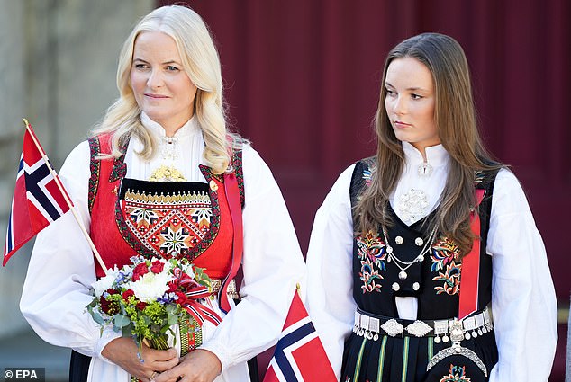 Princess Ingrid (right) donned an elaborate traditional Norwegian black dress with a white blouse.