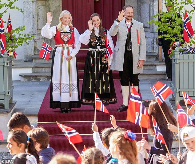 Norway's royal family dressed in traditional costume to celebrate their country's National Day today.