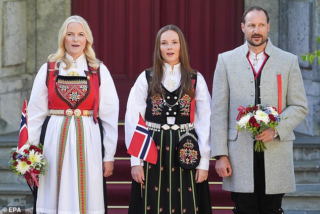 Crown Princess Mette-Marit, 50 (left), appeared in high spirits for Norway's Constitution Day with her husband, Crown Prince Haakon, 50 (right), at their Skaugum estate in Oslo.