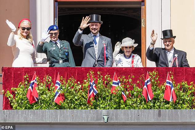 Mette-Marit, Ingrid Alexandra and Crown Prince Haakon waved from their balcony alongside Queen Sonja and King Harald V of Norway.