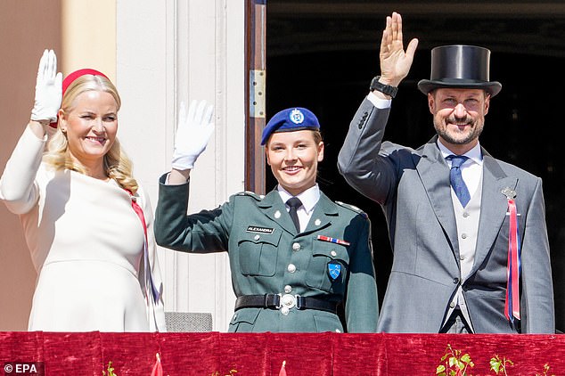 The family changed clothes later that day and greeted the train of children during Norway's Constitution Day celebrations.