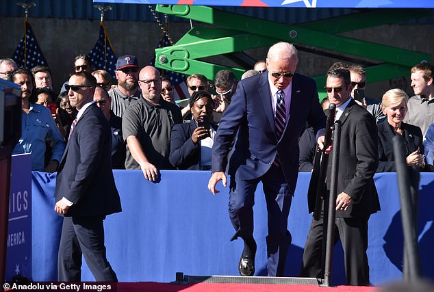 US President Joe Biden stumbles down the stairs before his remarks on Israel in Philadelphia, Pennsylvania, in October 2023.