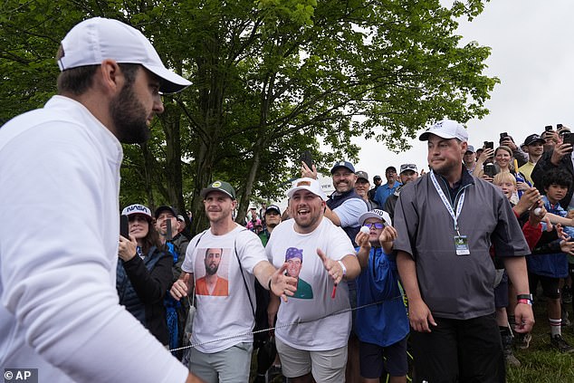 He left the field to cheers and high-fives, including one whose shirt read: 