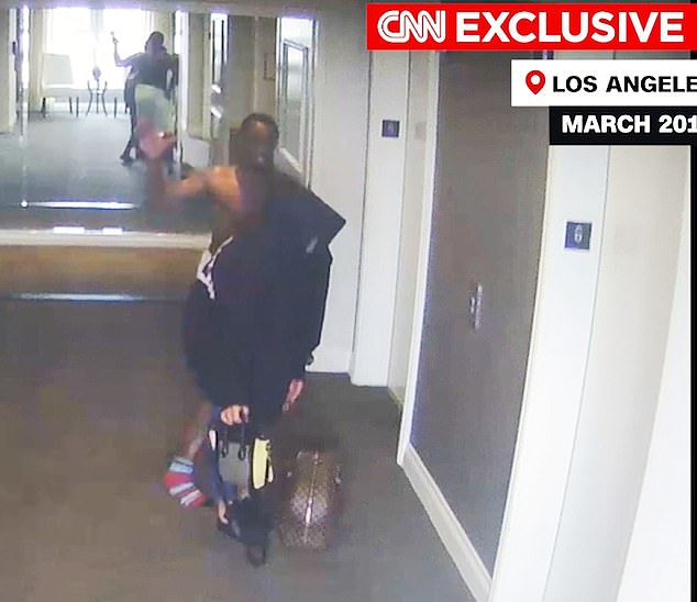 Cassie is seen trying to flee in an elevator. Diddy, after chasing her down the hallway, grabbed her by the back of her sweatshirt and threw her to the floor.