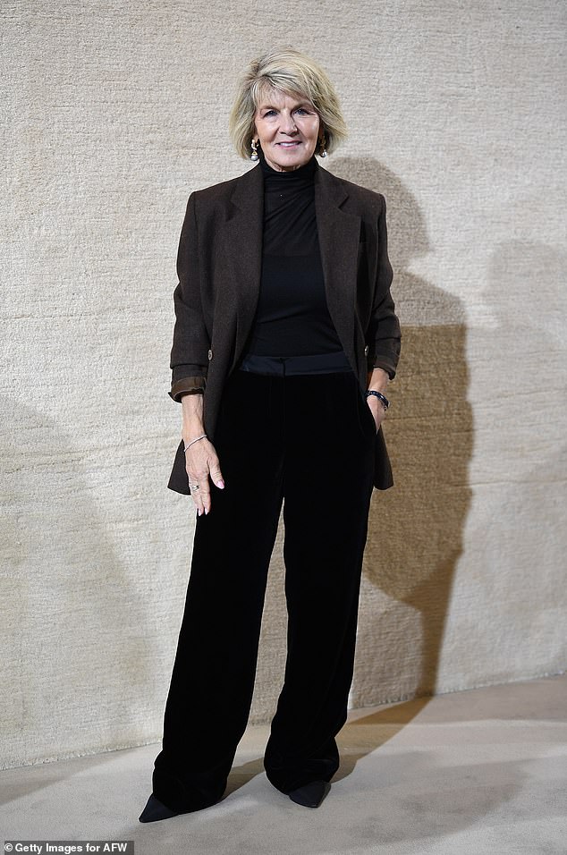 She made a solo entrance at the Viktoria & Woods show at Sydney's Carriageworks on Monday, sporting a brown coat, black turtleneck and trousers.