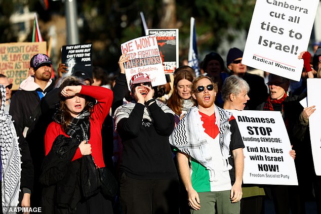 A group of pro-Palestinian protesters breached security, entered the course and could be heard singing outside the main room where the speeches were given.