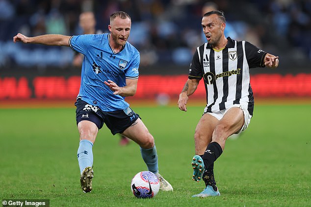 Lewis, right, played for the Macarthur Bulls in the Australian A-League competition.